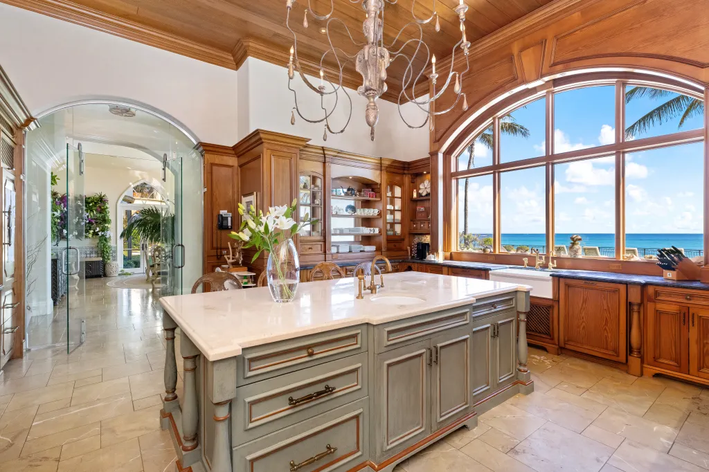 Arched windows and entries frame the open chef's kitchen