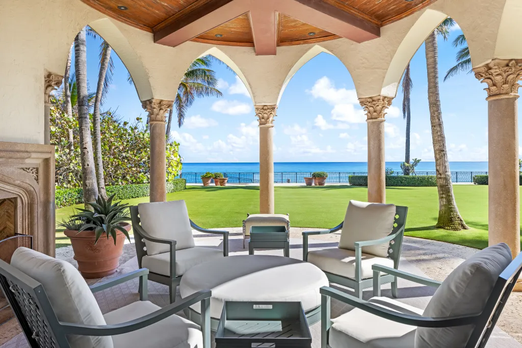 A covered porch area comes with water views