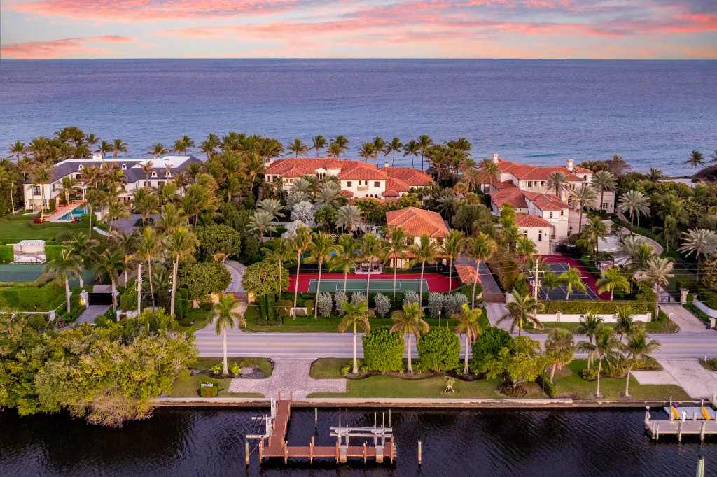 The lake to ocean property features two pools and a dock