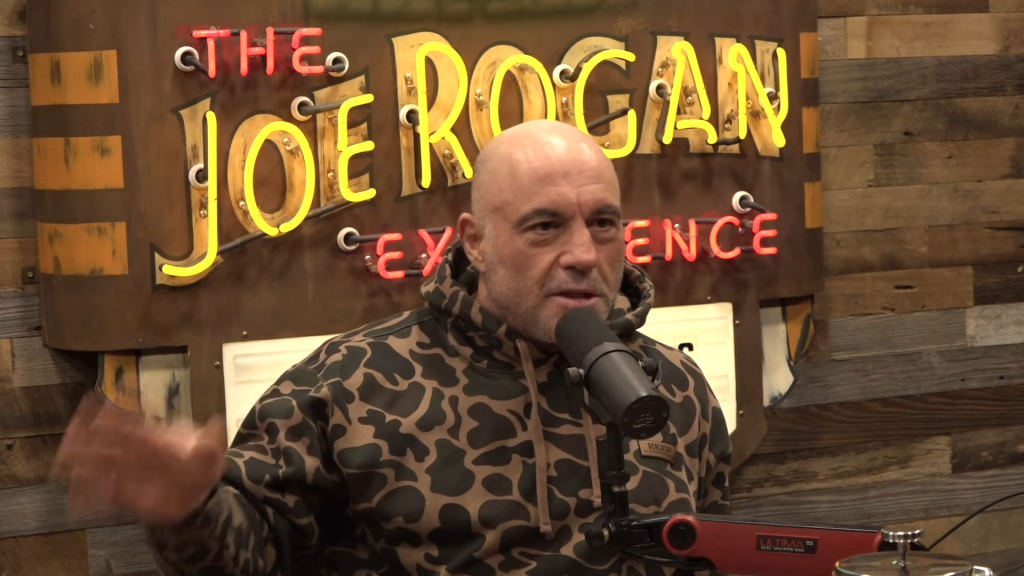 Joe Rogan speaking into a microphone.