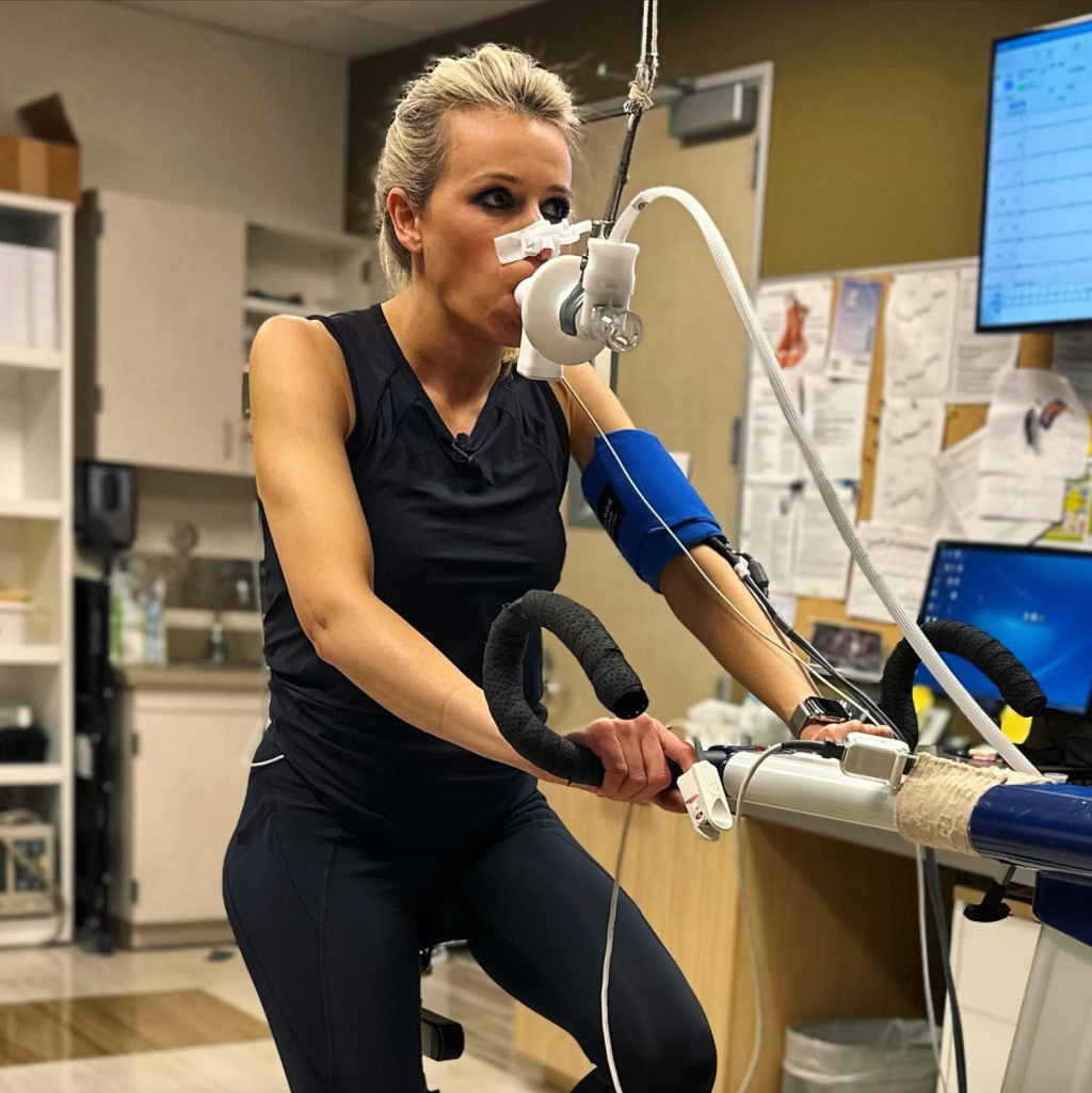 Lara Lewington conducting a fitness age test on an exercise bike.