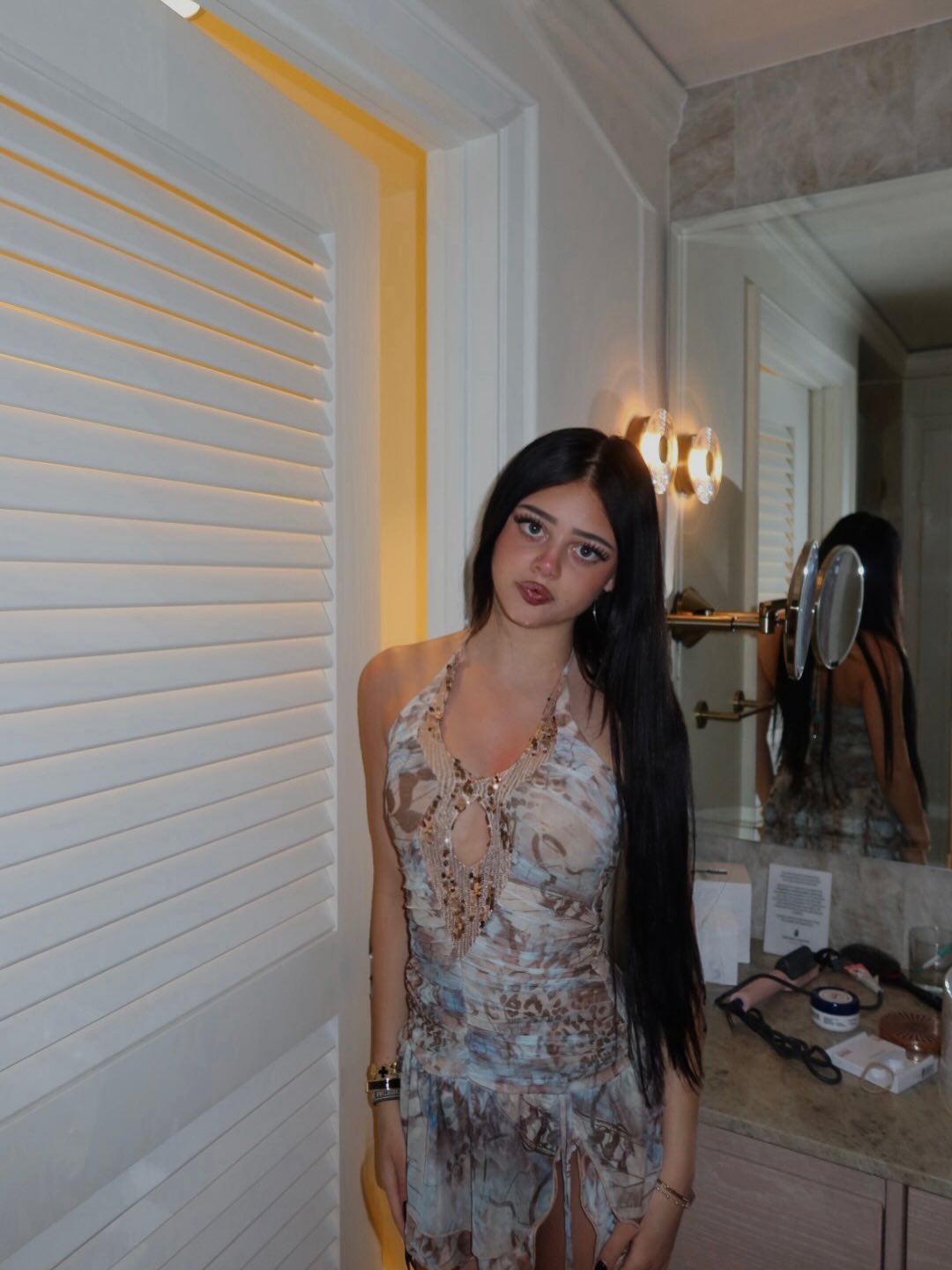 Harlow Madden in a halter dress with bead embellishments.