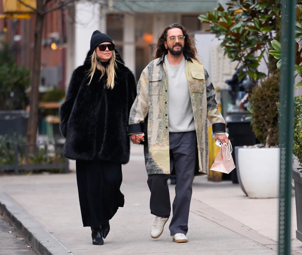 Heidi Klum and Tom Kaulitz walking hand-in-hand in New York City.
