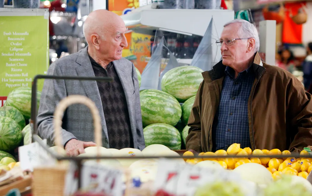 Henry Reagan and Happy Jack discussing a police shooting.