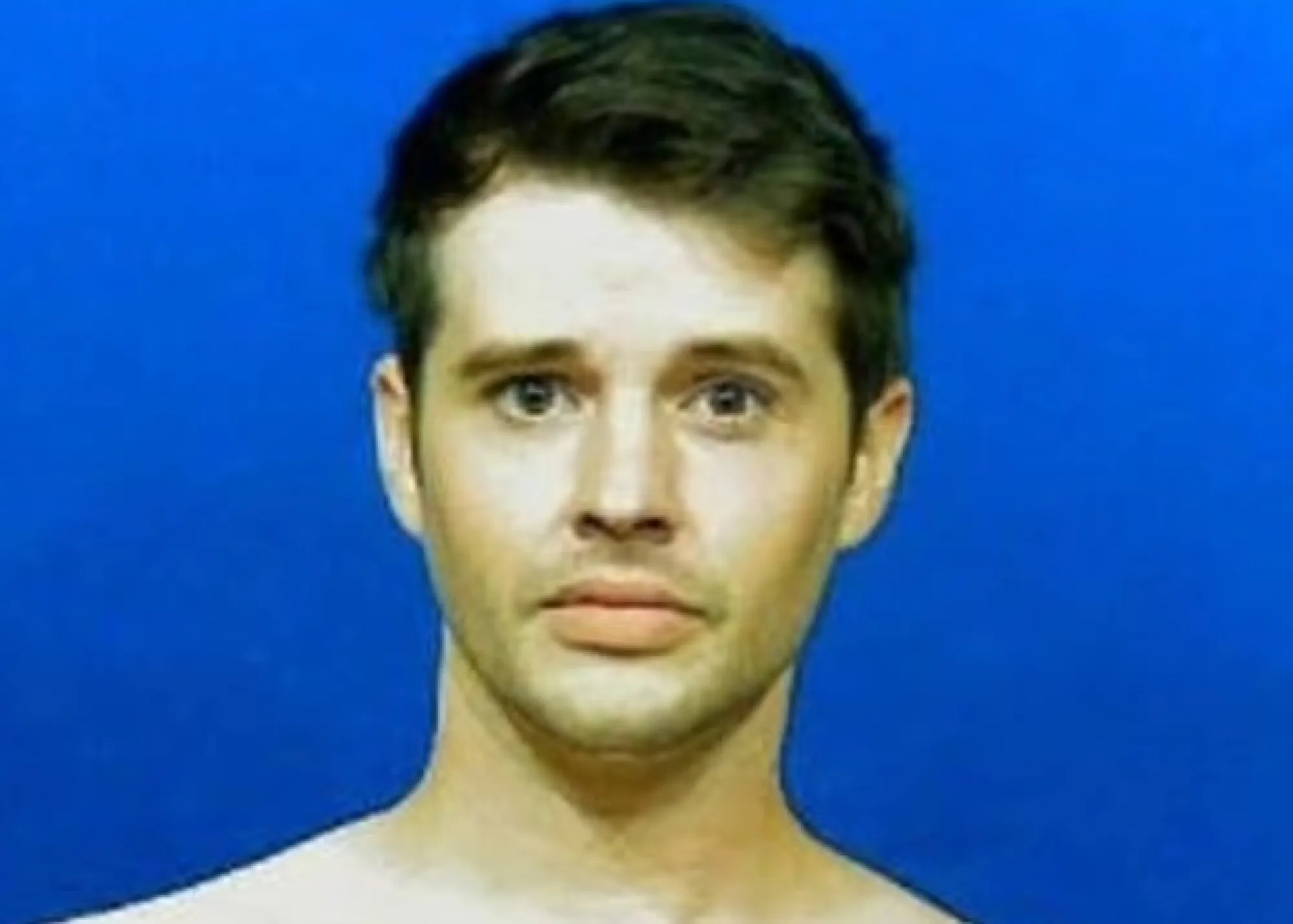 Matthew Prokop's mugshot with a blue background.