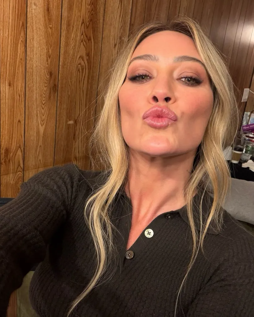 Hilary Duff pouting with pursed lips in a selfie.