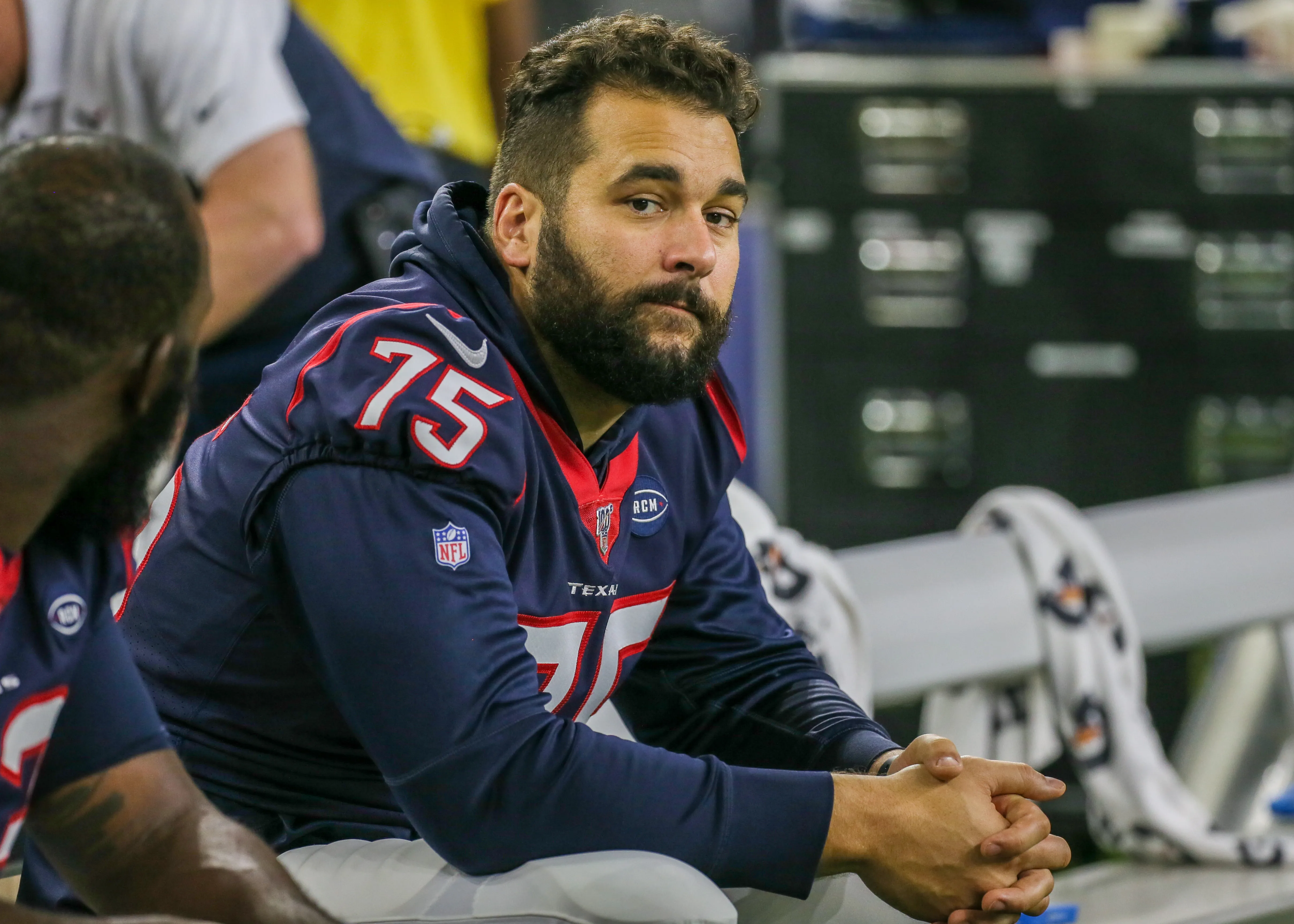 Houston Texans offensive tackle Matt Kalil sits on the sidelines during a game.