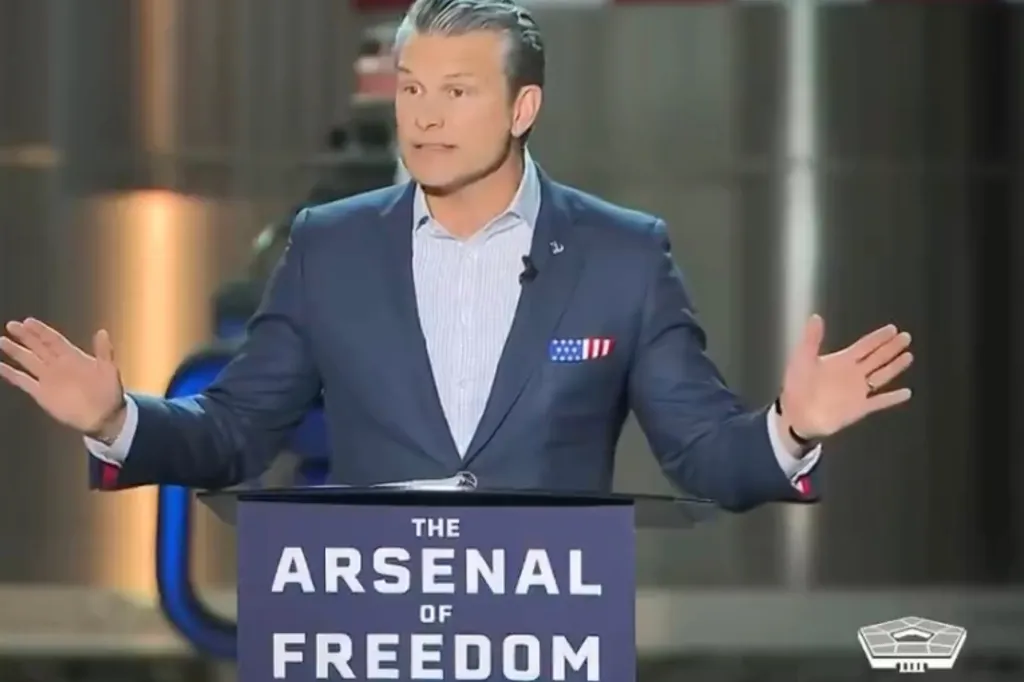 Pete Hegseth speaking at a podium with 