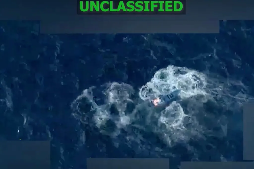An unclassified aerial image of a drug boat with the text 