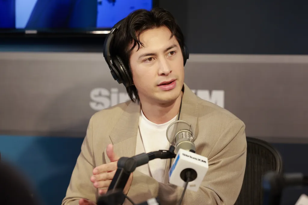 Hudson Williams wearing headphones at a SiriusXM studio.