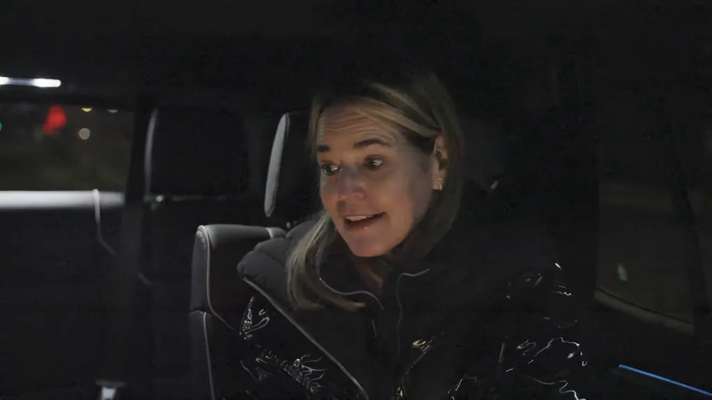 Savannah Guthrie looking surprised in a car at night.