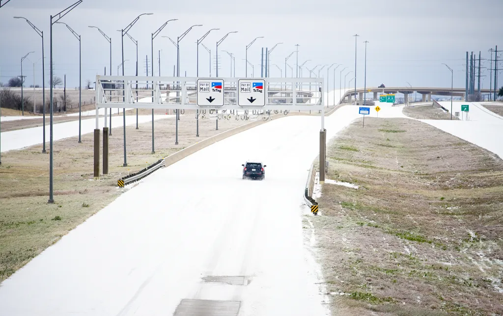 Icy roads in Pflugerville, Texas, after a winter storm brought rain, sleet, and freezing temperatures on Sunday, Jan. 25, 2026. 