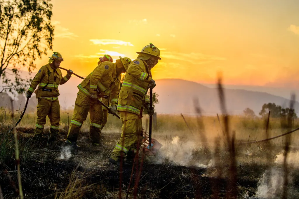 CFA firefighters conducting black-out operations at dusk after a bushfire near Alexandra.