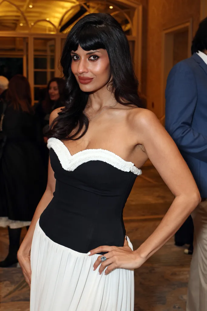 Jameela Jamil in a black and white strapless gown.