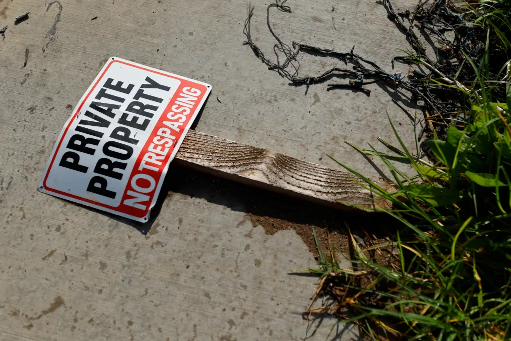 A fallen sign reading 