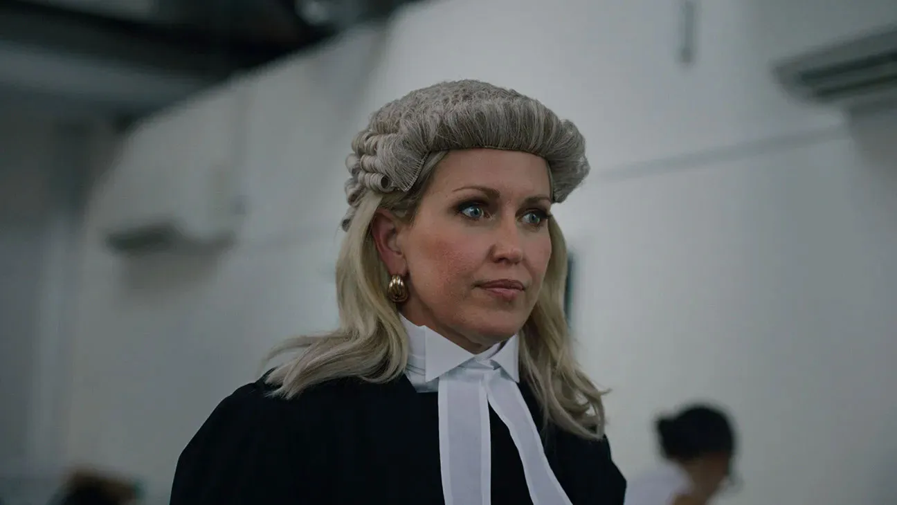 Jennifer Robinson wearing a barrister's wig, robes, and a white jabot.