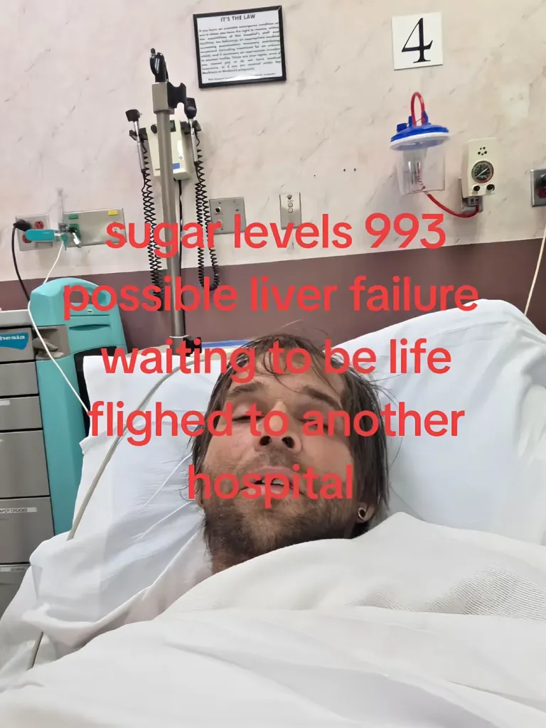 Jeremiah Raber in a hospital bed with text overlay about his sugar levels, possible liver failure, and transfer to another hospital.