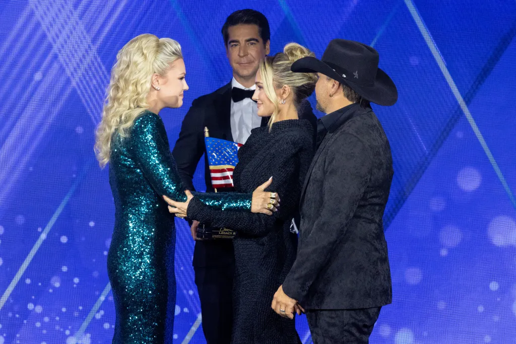 Jesse Watters, Jason and Brittany Aldean give Charlie Kirk’s widow Erika, left, the Charlie Kirk Legacy award at the 7th annual FOX Nation Patriot Awards.