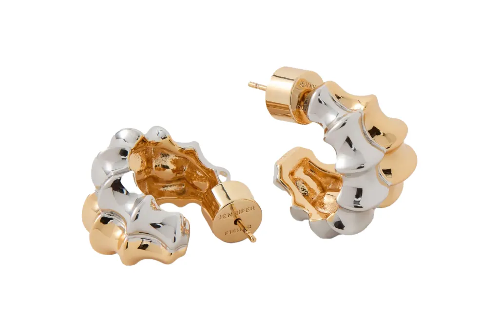 Two Jennifer Fisher silver and gold-tone curved earrings.