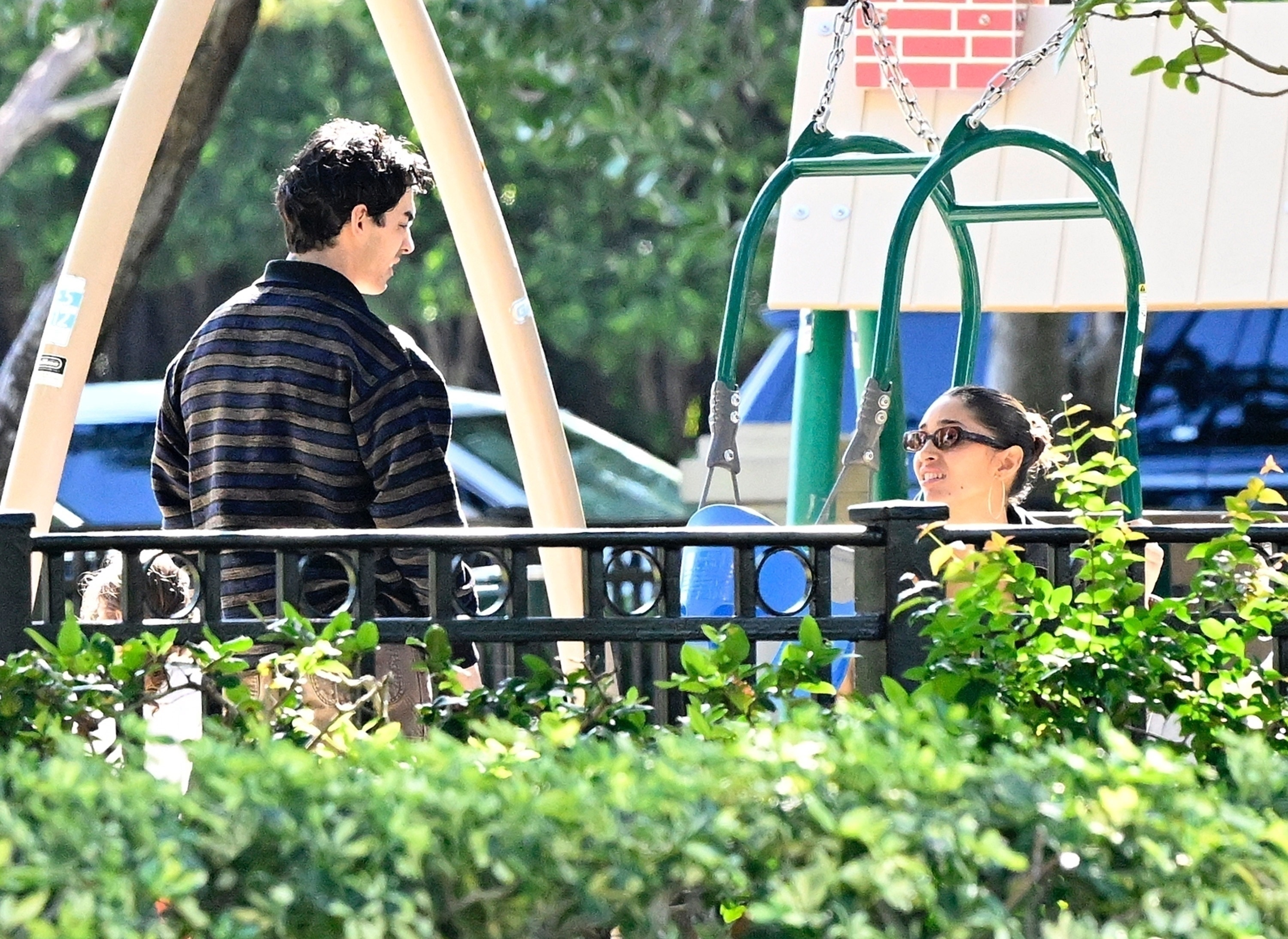 Joe Jonas looking at Tatiana Gabriela in a playground in Miami.