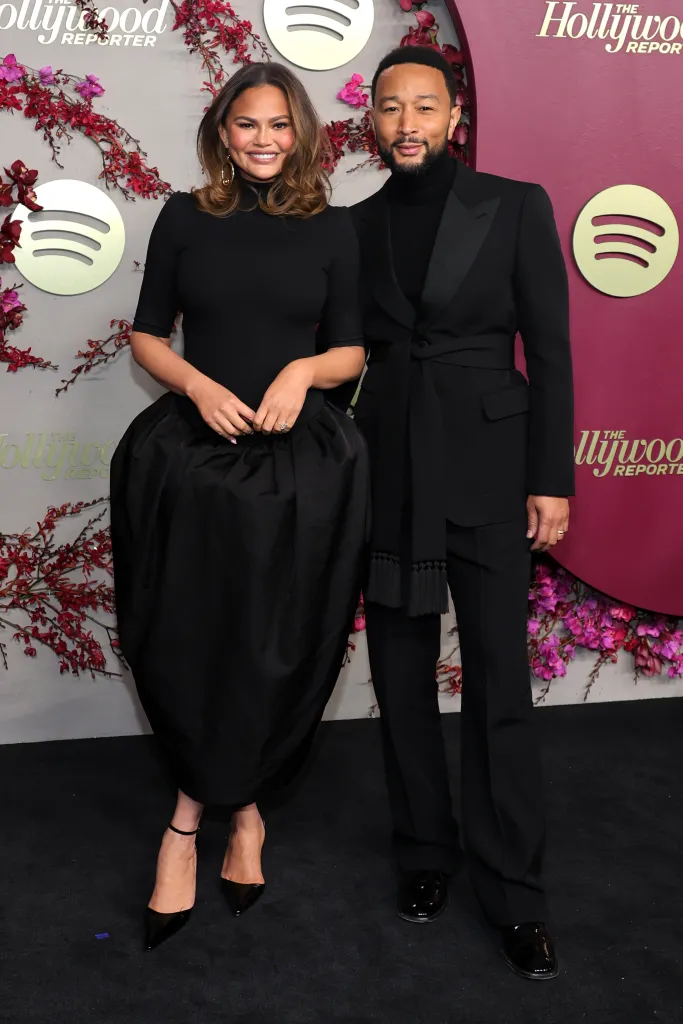 Chrissy Teigen and John Legend attend an event.