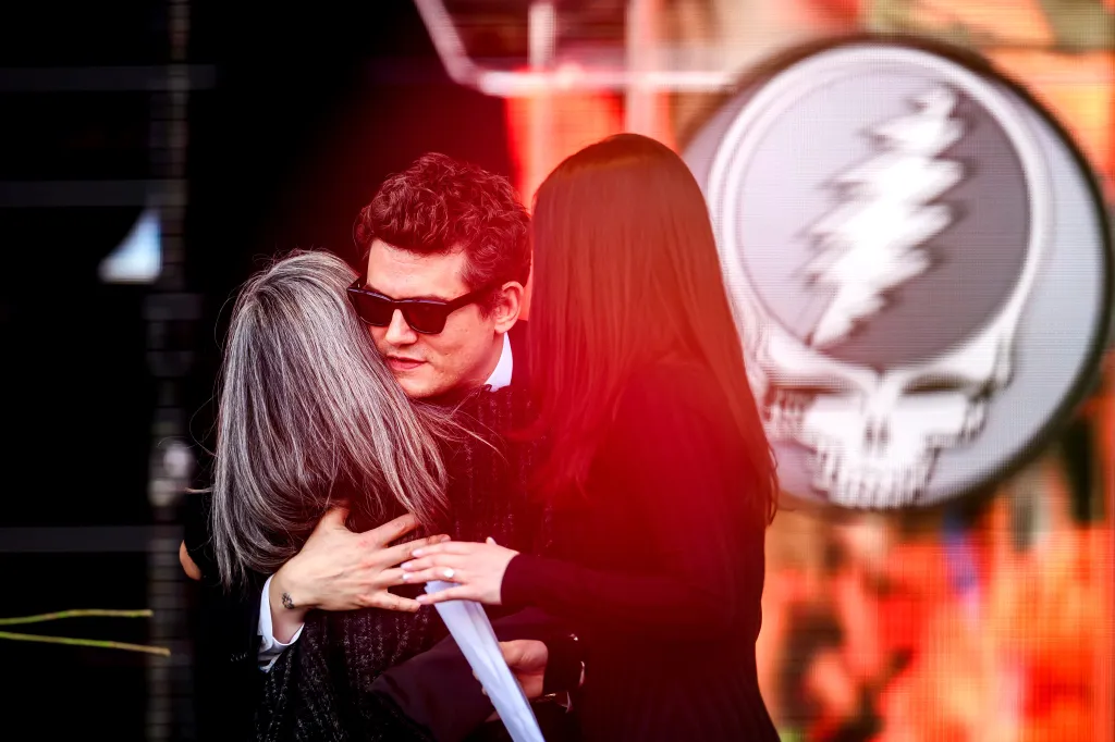 John Mayer embraces Natascha Münter during a public memorial for her husband, Grateful Dead guitarist Bob Weir, on Saturday, Jan. 17, 2026, in San Francisco. 