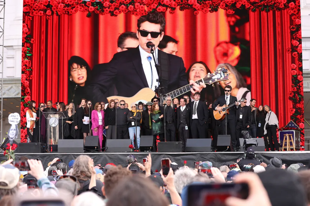 John Mayer playing guitar.