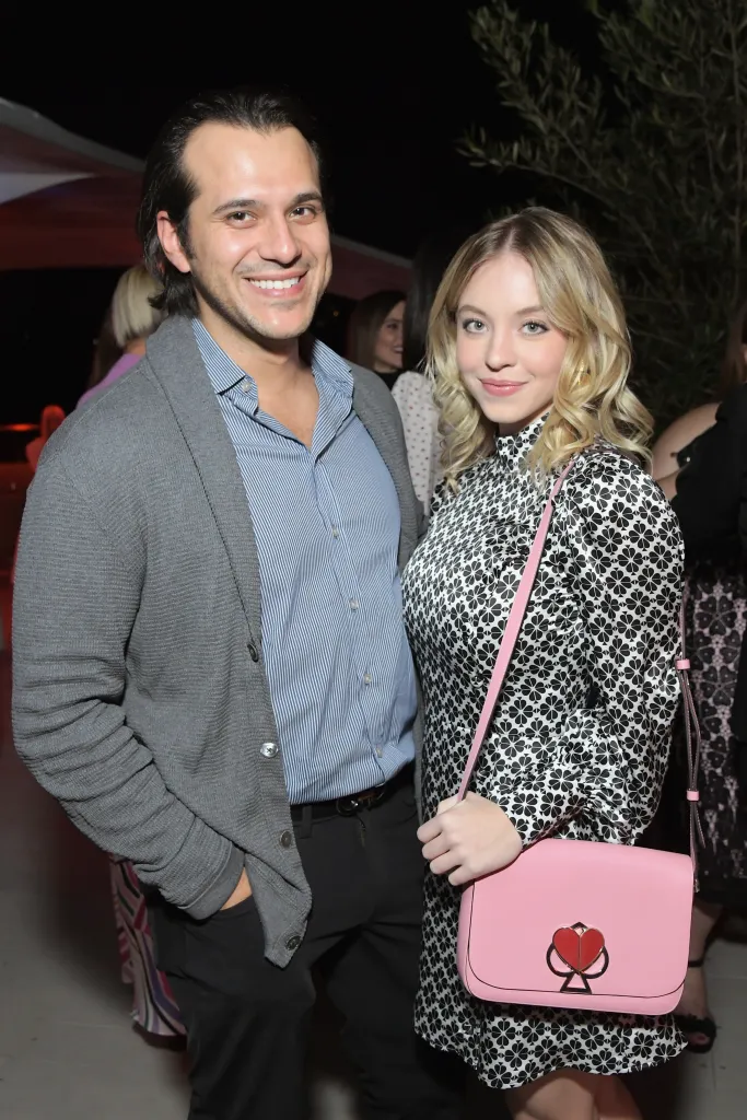 Jonathan Davino and Sydney Sweeney posing at the InStyle and Kate Spade dinner.
