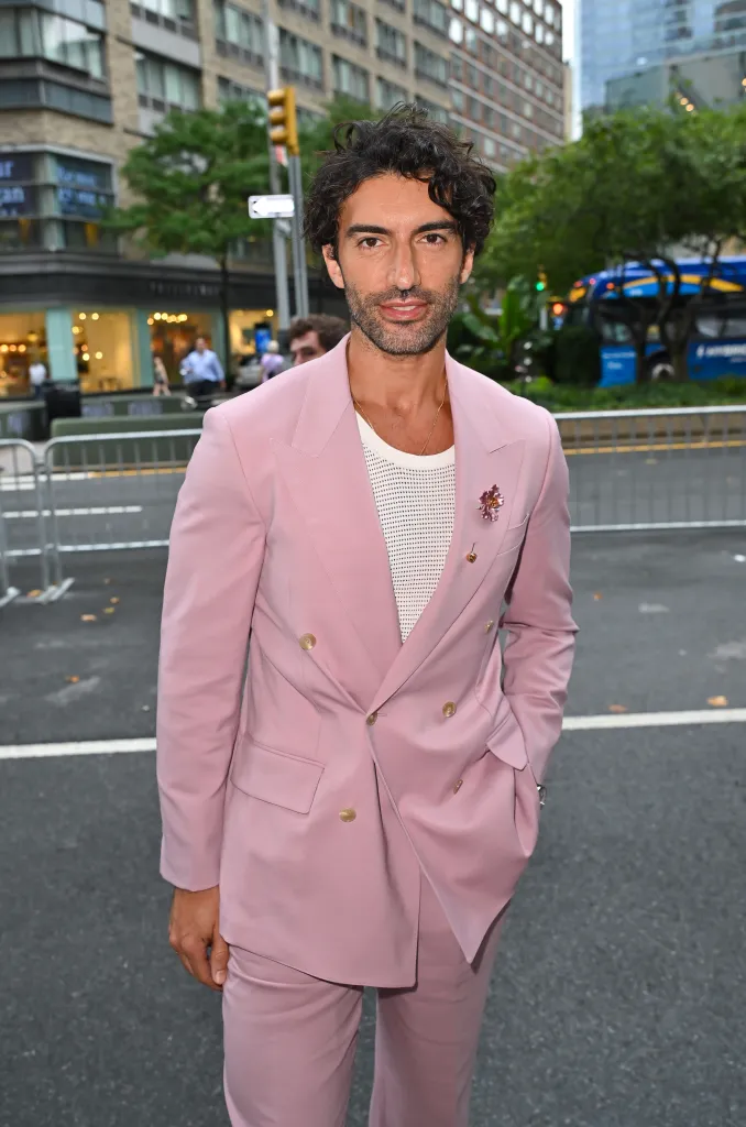 Justin Baldoni in a pink suit at the 