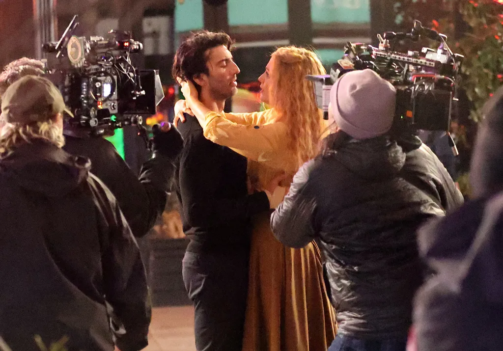 Blake Lively and Justin Baldoni embrace while filming