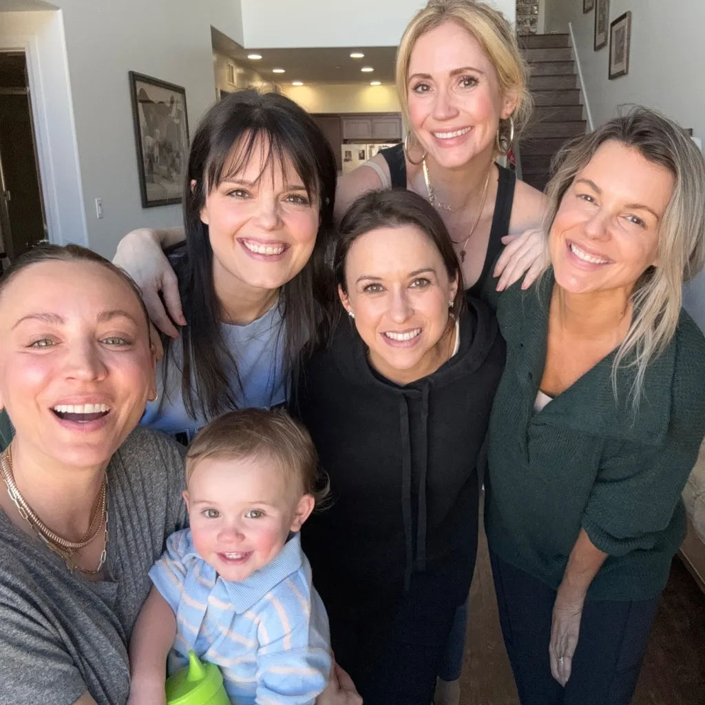 Kaley Cuoco and five female friends with a baby.