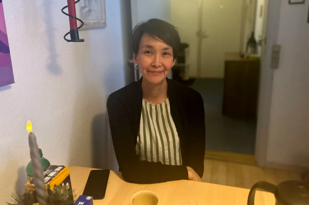 Karen Hammeken Jensen, a Greenland resident, seated at a table.