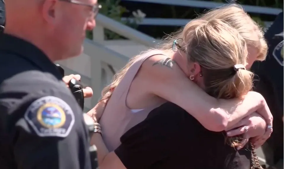 Karen Laramie, mother of Madison Mogan, and Kristi Goncalves, Kaylee Goncalves' mother, embrace after the sentencing hearing for their daughters' murderer.