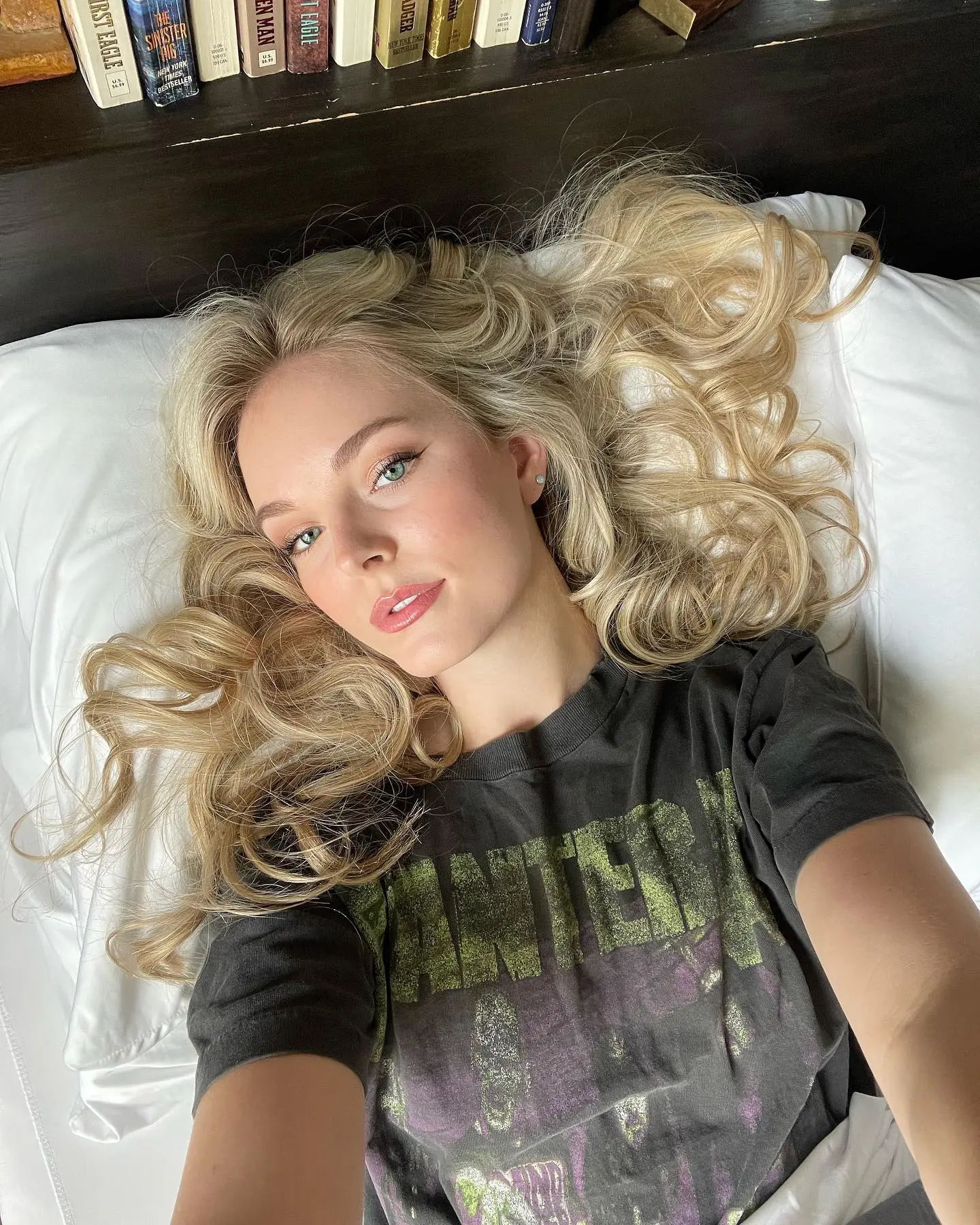 Karley Scott Collins lying on a pillow, looking up at the camera.