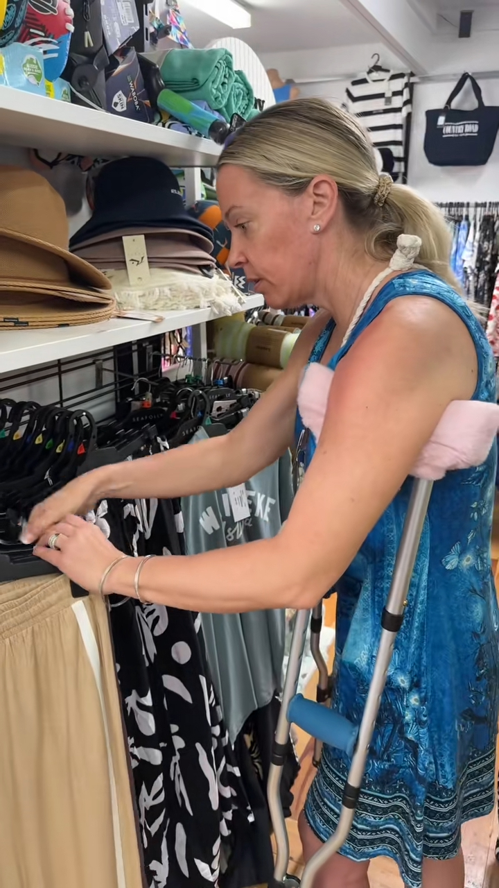 Kate Gosselin wearing a diamond ring on her left hand while using crutches and shopping in New Zealand.
