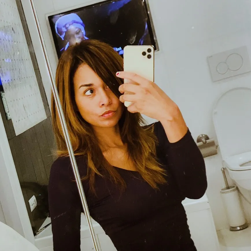 Katie Rost taking a mirror selfie.