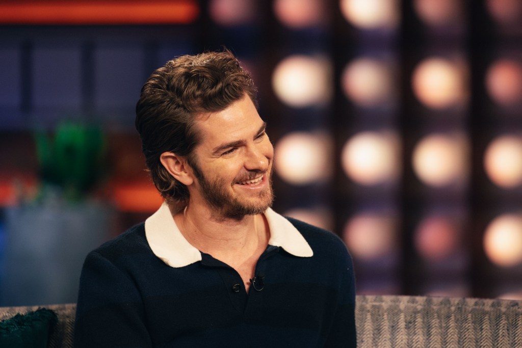 Andrew Garfield smiling during an appearance on The Kelly Clarkson Show.