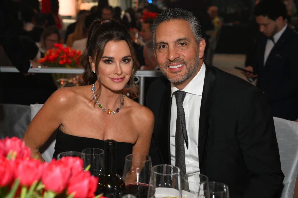Kyle Richards and Mauricio Umansky smiling at the Elton John AIDS Foundation's 31st Annual Academy Awards Viewing Party.