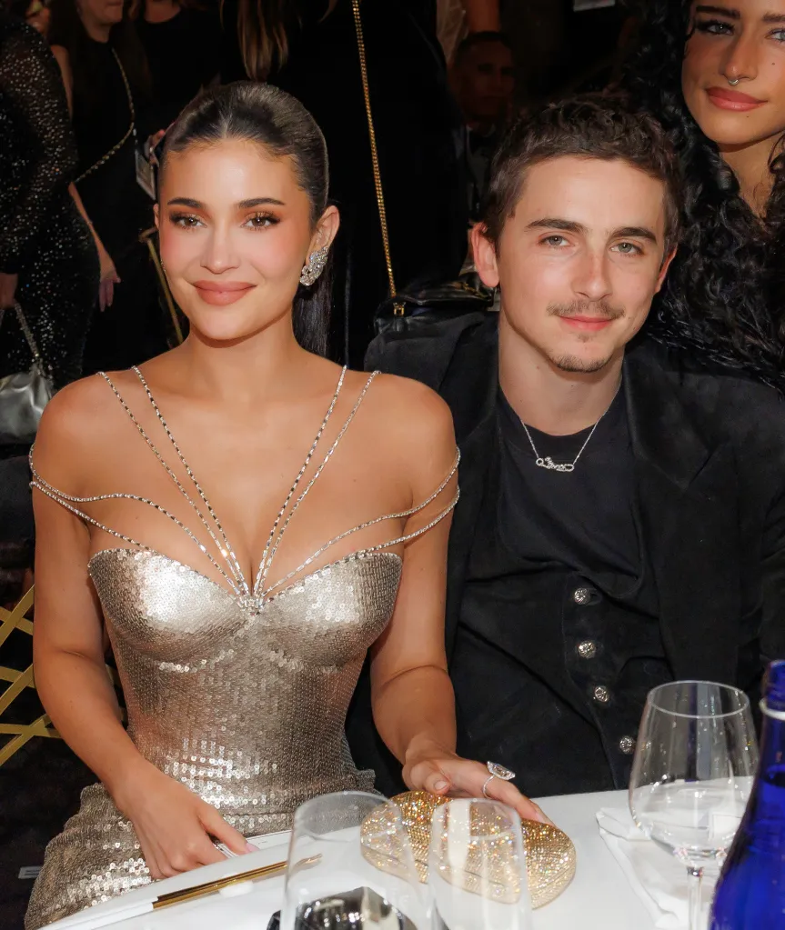 Kylie Jenner and Timothée Chalamet sitting at a table.