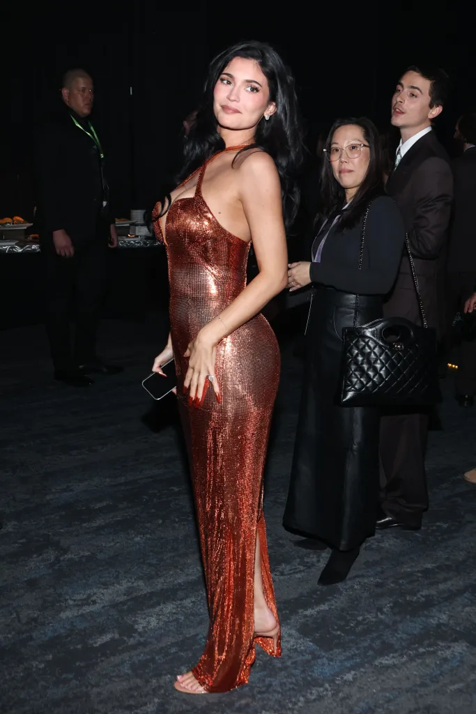 Kylie Jenner in an orange metallic dress at the 37th Annual Palm Springs International Film Festival Film Awards.