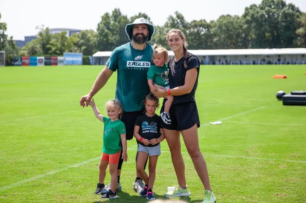 Kylie Kelce, Jason Kelce and their daughters pose together.