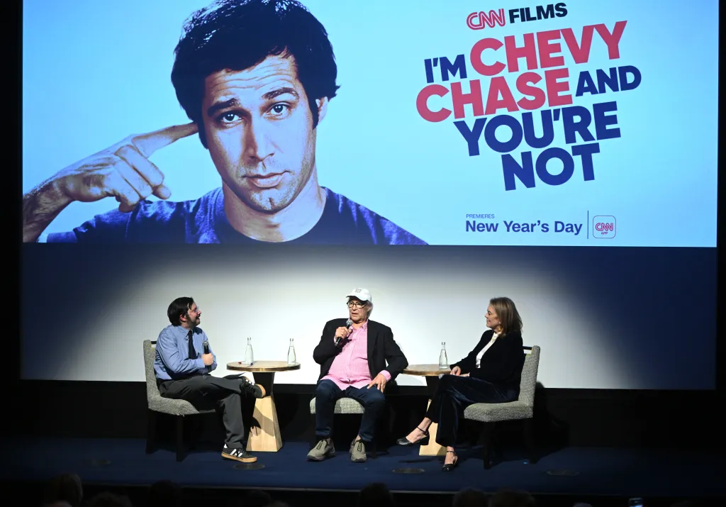 Chevy Chase and Marina Zenovich promoting Chevy's new documentary in NYC on December 4
