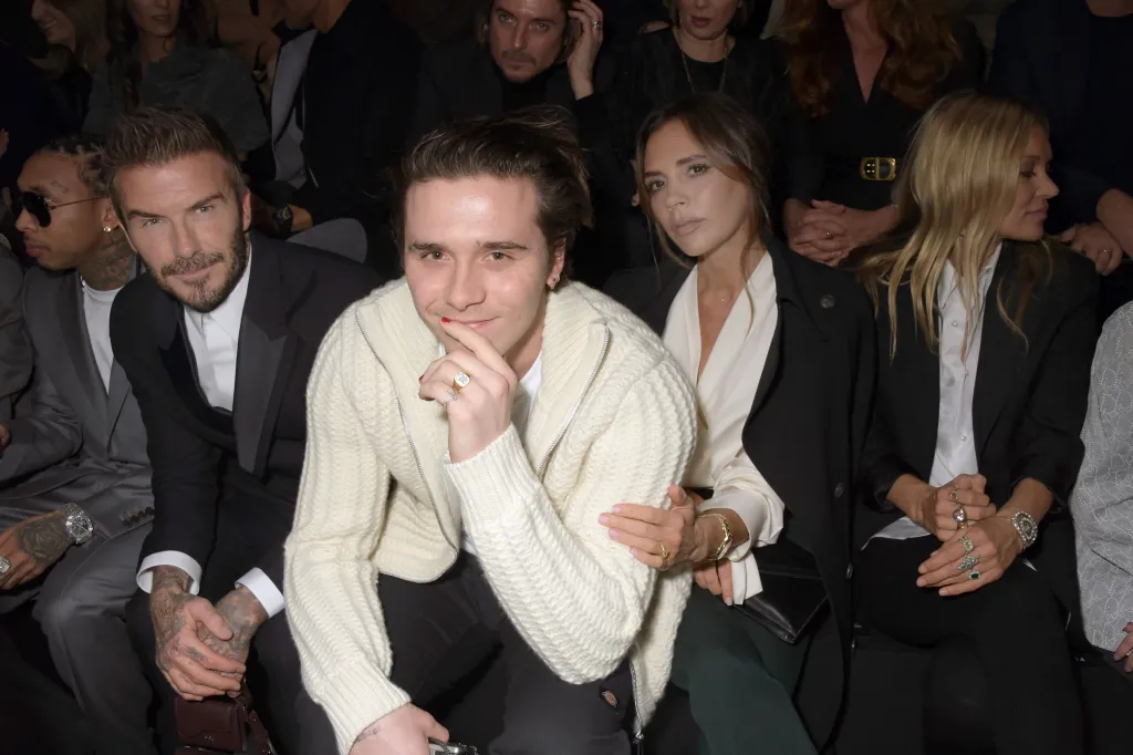 David Beckham, Brooklyn Beckham, Victoria Beckham, and Kate Moss attend the Dior Homme Menswear Fall/Winter 2020-2021 show.