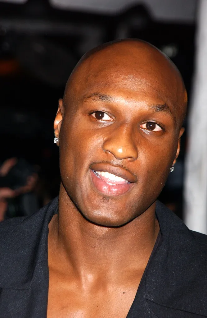 Lamar Odom smiling at the opening night of Jay-Z's 40/40 sports bar.