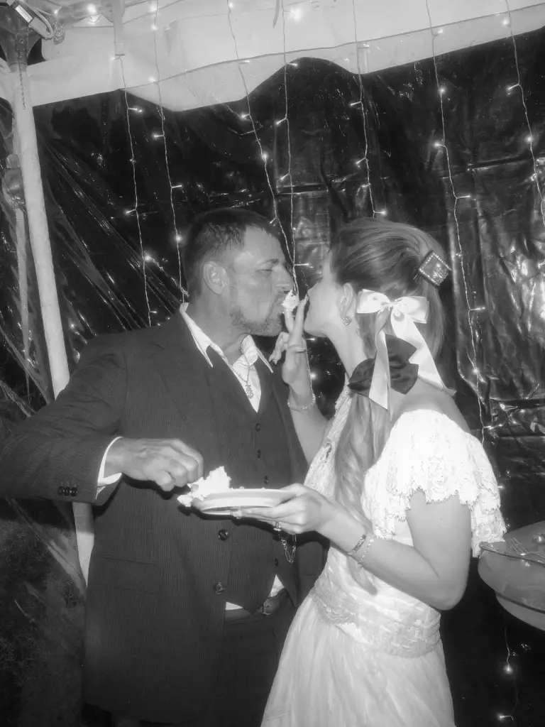 Lana Del Rey feeding cake to her husband Jeremy Dufrene.