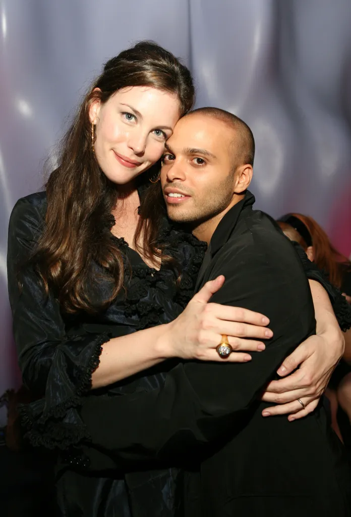 Liv Tyler and Richie Akiva embracing at the Vonage V-PHONE launch party.