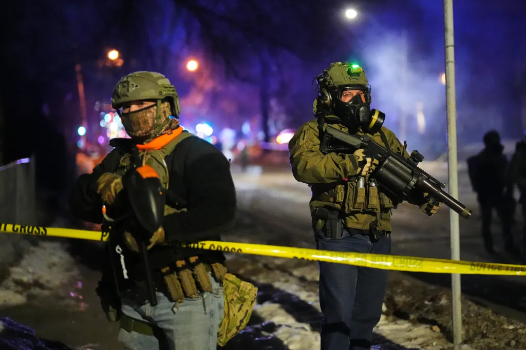 Law enforcement officers at the scene of the shooting in Minneapolis on Jan. 14, 2026.