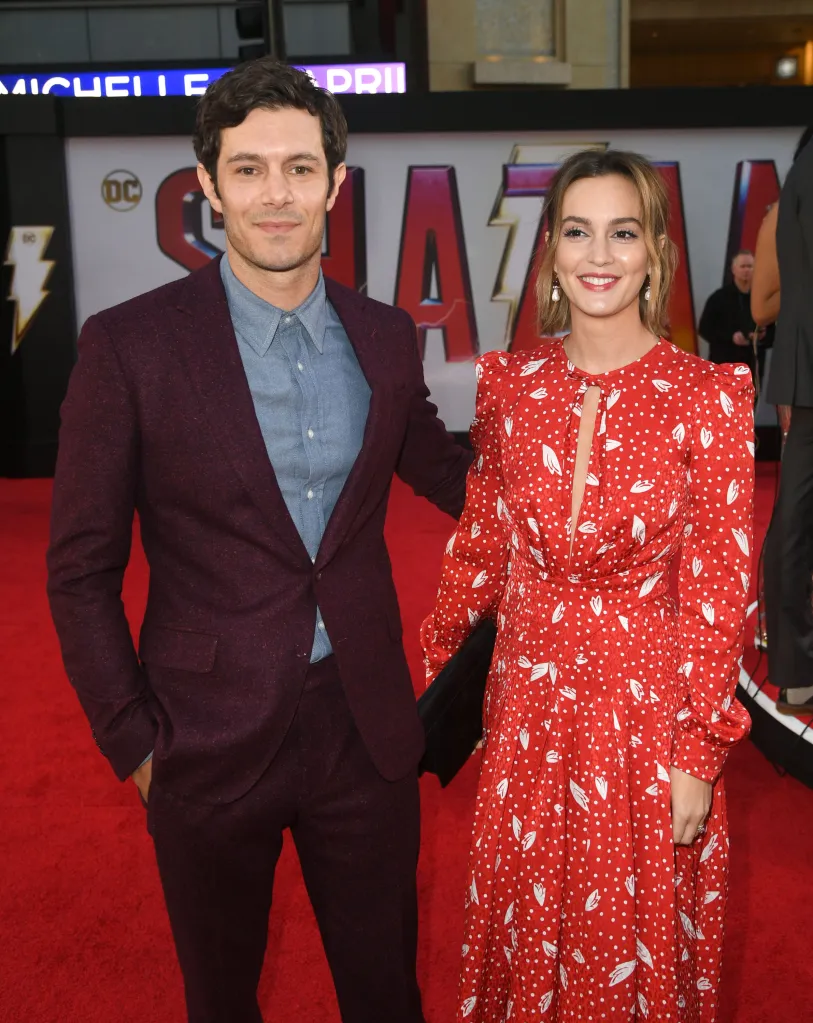 Adam Brody and Leighton Meester smiling on a red carpet.