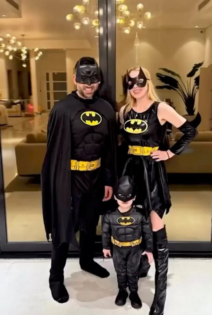 Lindsay Lohan, her husband, and their son dressed in Batman costumes.