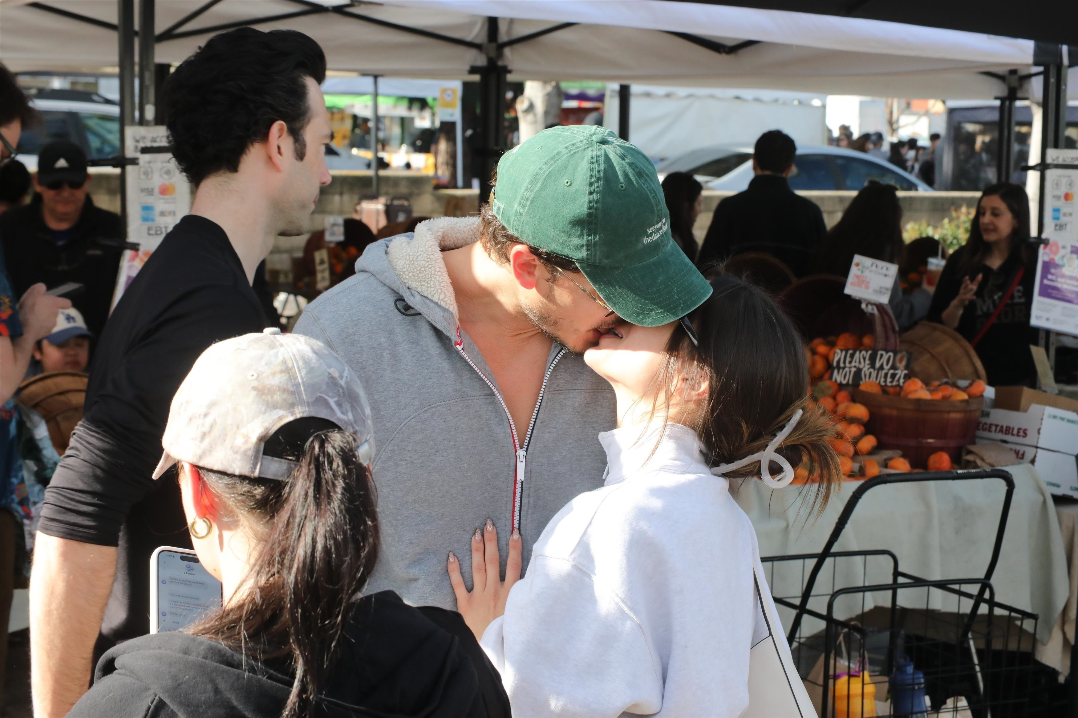 Gleb Savchenko kisses a mystery woman at the Studio City Farmers Market.